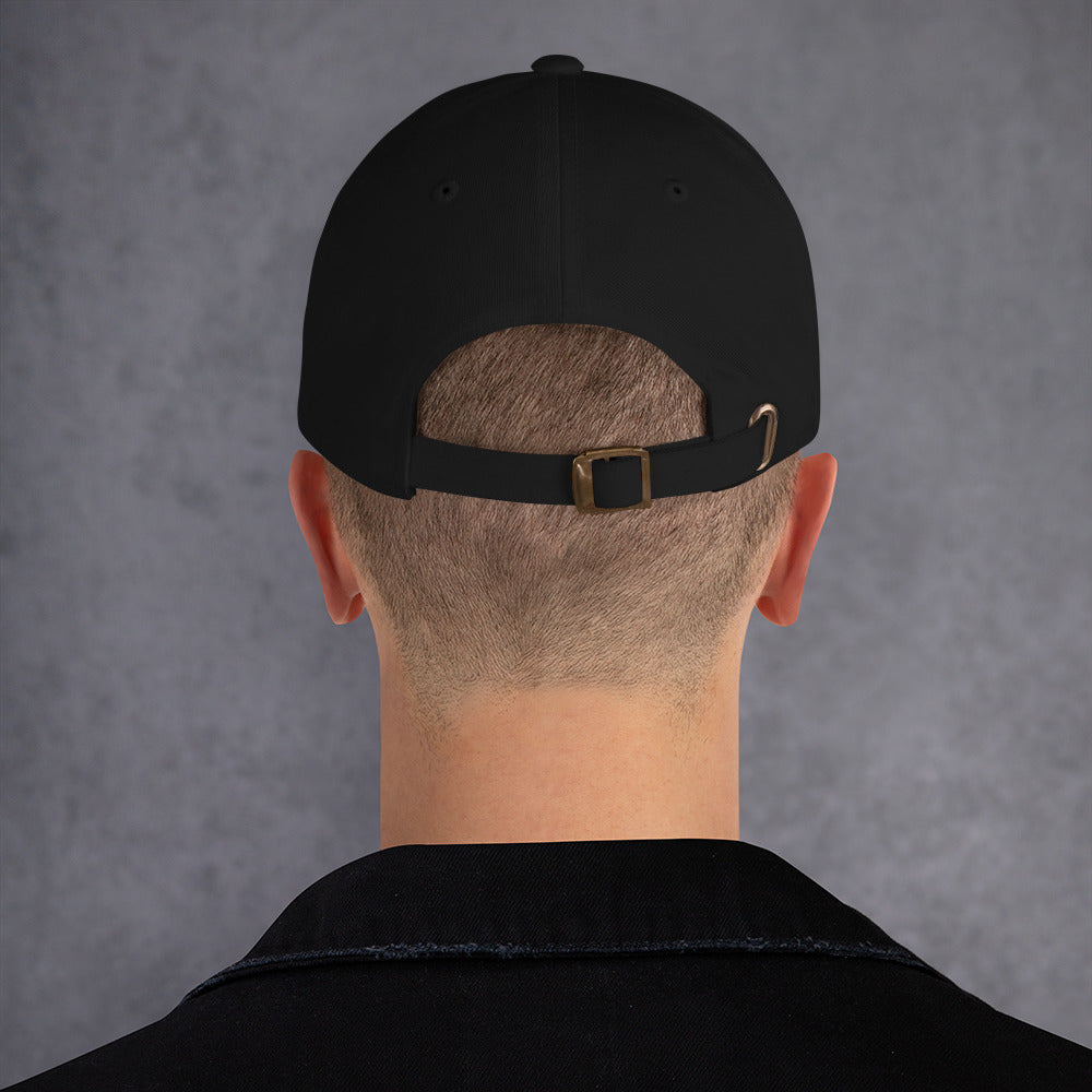 Back view of a black unstructured dad hat featuring an adjustable metal buckle strap, low profile design, and curved visor.