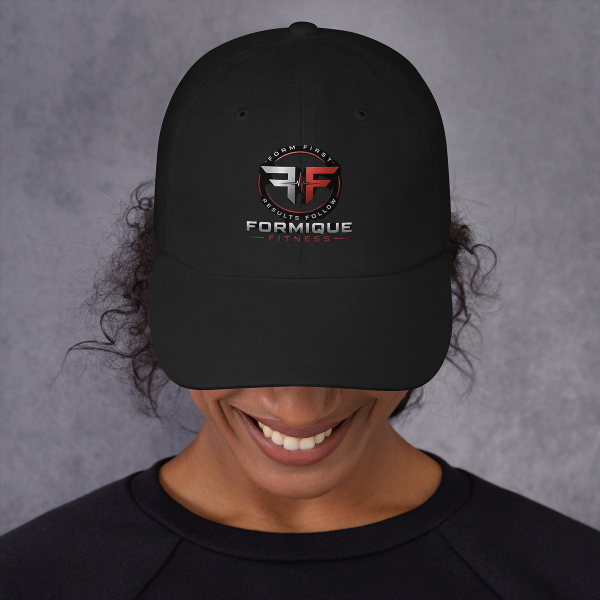 Black unstructured dad hat with curved visor featuring embroidered Formique Fitness logo and "Form First Results Follow" text.