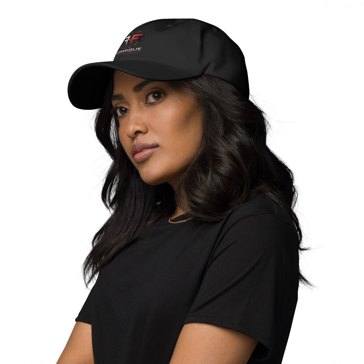 Woman wearing black Formique Fitness low-profile dad hat with curved visor and embroidered logo. Unstructured 6-panel adjustable cap.